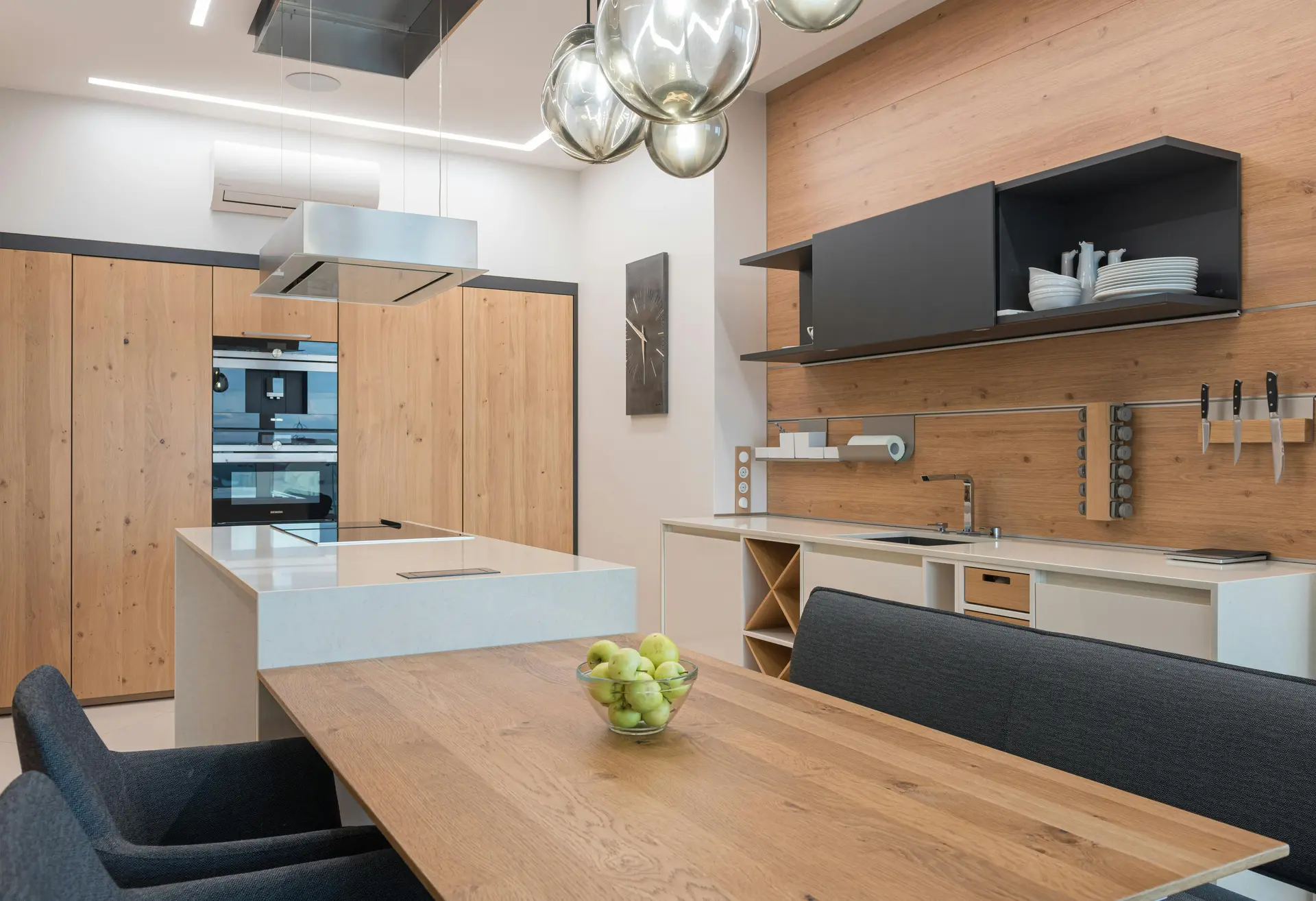 Light pine kitchen with island and brass hardware