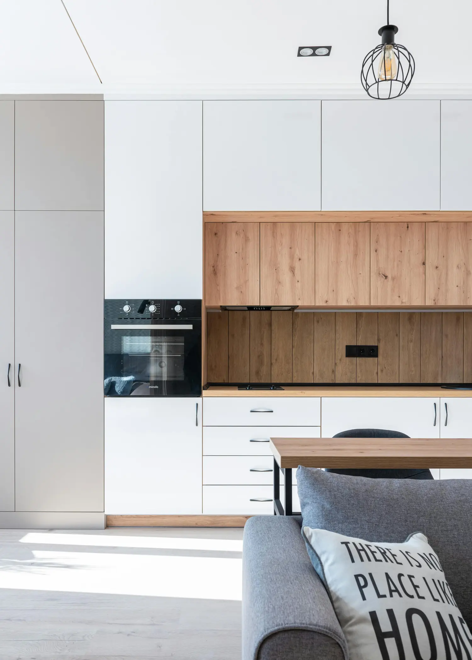 Custom kitchen with wood cabinetry and stone countertop